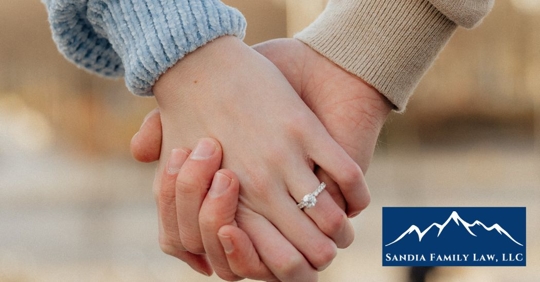 closeup of two people holding hands